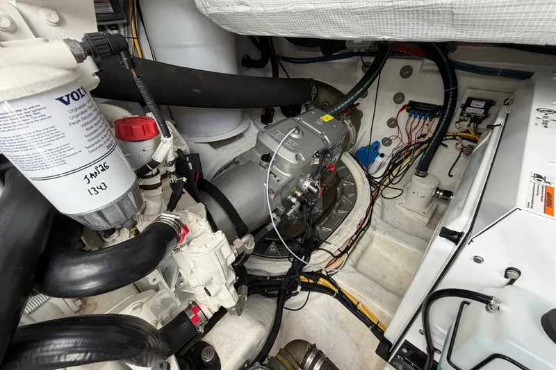 Slide: The Image of Engine room of 2020 Sabre 58 Salon Express, showcasing mechanical components and wiring. - 54