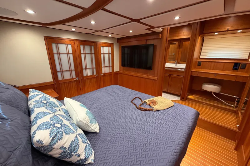 Slide: The Image of Luxurious 2020 Sabre 58 Salon Express bedroom with elegant wood finishes and modern amenities. - 24