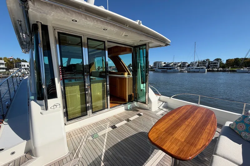 Slide: The Image of 2020 Sabre 58 Salon Express yacht with elegant deck and waterfront view. - 38