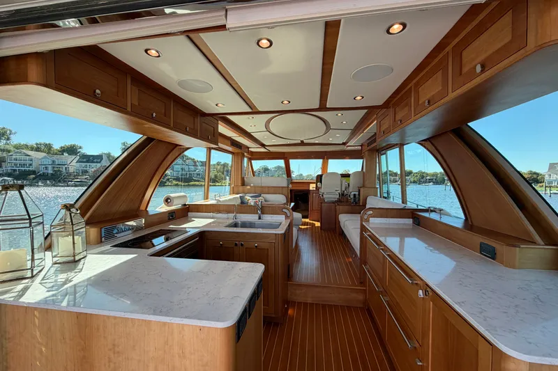 Slide: The Image of Luxurious interior of 2020 Sabre 58 Salon Express yacht with elegant wood finishes and waterfront view. - 2