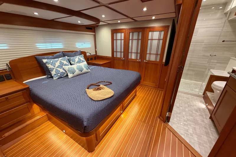 Slide: The Image of Luxurious 2020 Sabre 58 Salon Express bedroom with elegant wood finish and modern ensuite bathroom. - 22