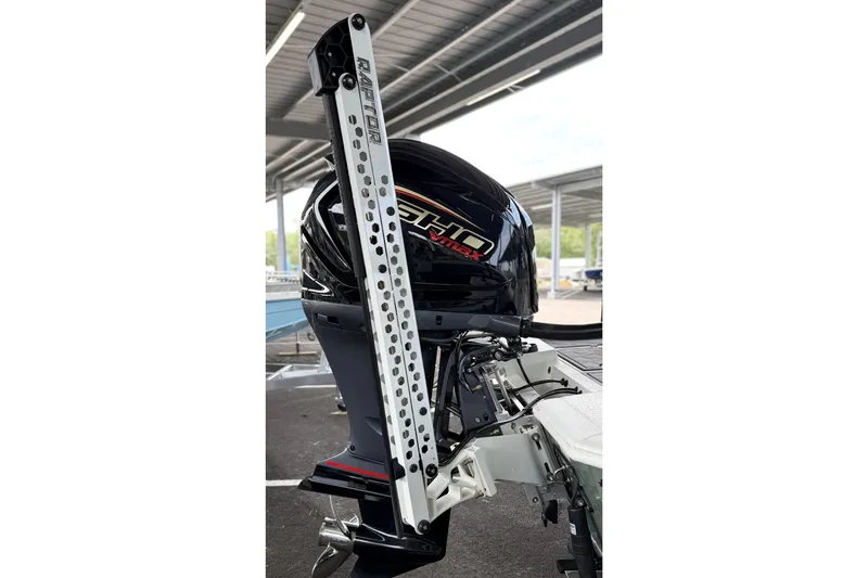 Slide: The Image of Outboard motor on Avid 23 Mag 2027 boat with Raptor mount in covered dock. - 14