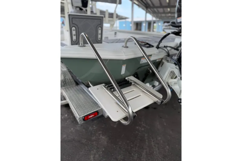 Slide: The Image of Avid 23 Mag 2027 boat with stainless steel swim ladder and modern design. - 18