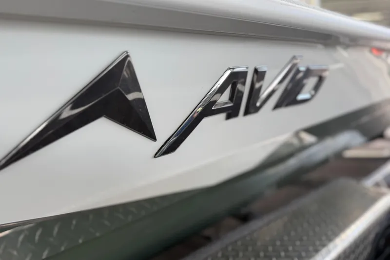 Slide: The Image of Close-up of 2027 Avid 23 Mag boat logo on white surface. - 13
