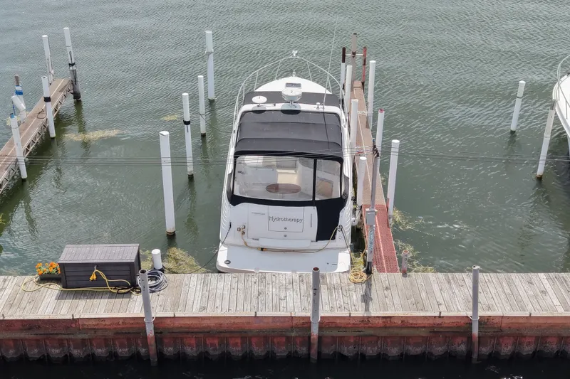Slide: The Image of 2008 Rinker 320 Express Cruiser docked at marina, aerial view. - 3