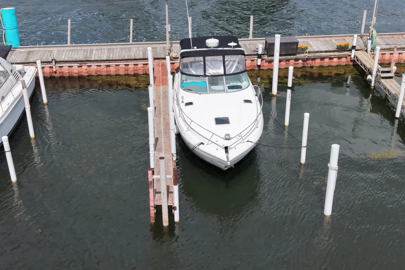 Slide: The Image of 2008 Rinker 320 Express Cruiser docked at marina, aerial view. - 6