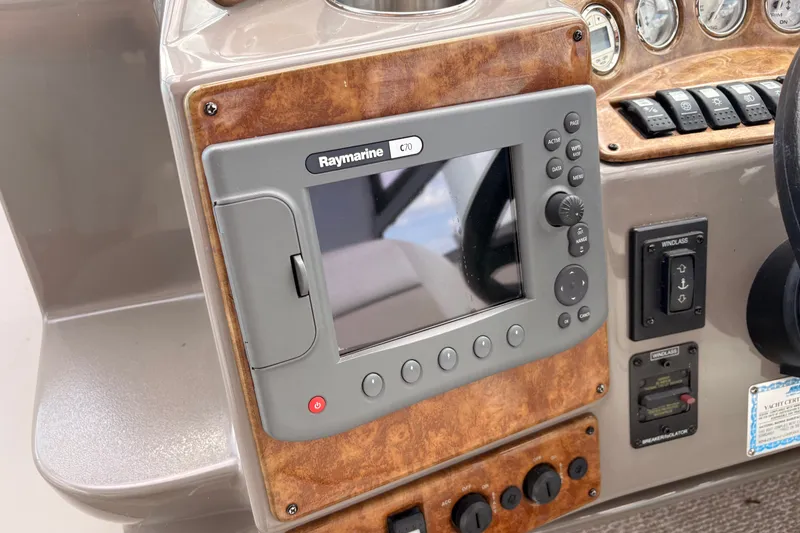 Slide: The Image of Control panel of a 2008 Rinker 320 Express Cruiser with Raymarine C70 display. - 14