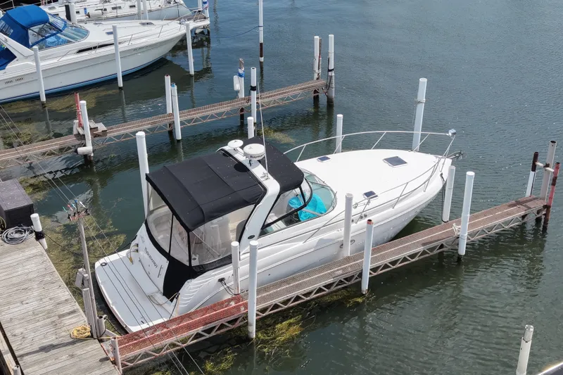 Slide: The Image of 2008 Rinker 320 Express Cruiser docked at marina, aerial view. - 4