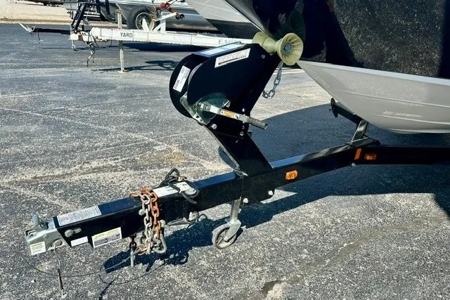 Slide: The Image of Trailer hitch of a 2013 Sea Ray 240 Sundeck boat on pavement. - 25