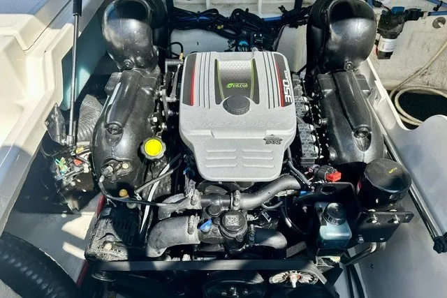 Slide: The Image of Engine of a 2013 Sea Ray 240 Sundeck boat, showcasing detailed components. - 23