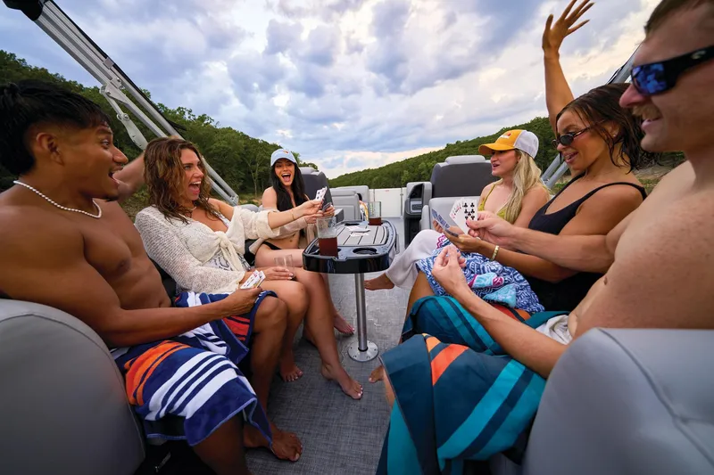 Slide: The Image of Manufacturer Provided Image: Group enjoying card game on 2026 Sun Tracker Party Barge 22 XP3 boat. - 15
