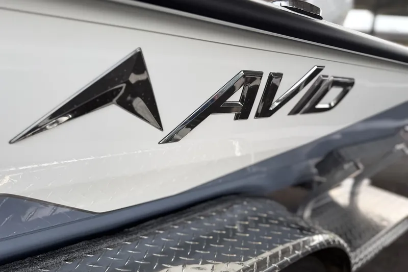 Slide: The Image of Close-up of 2027 Avid 22 Recon boat logo on metallic surface. - 6
