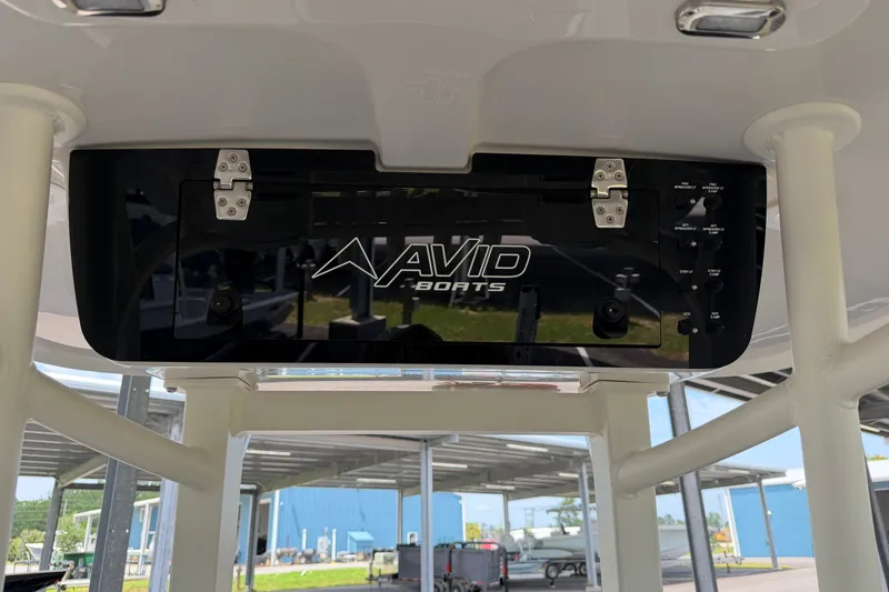 Slide: The Image of Avid 22 Recon 2027 boat console with control panel and logo. - 22