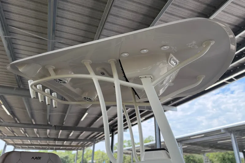 Slide: The Image of T-top of 2027 Avid 22 Recon boat with rod holders and speakers. - 20