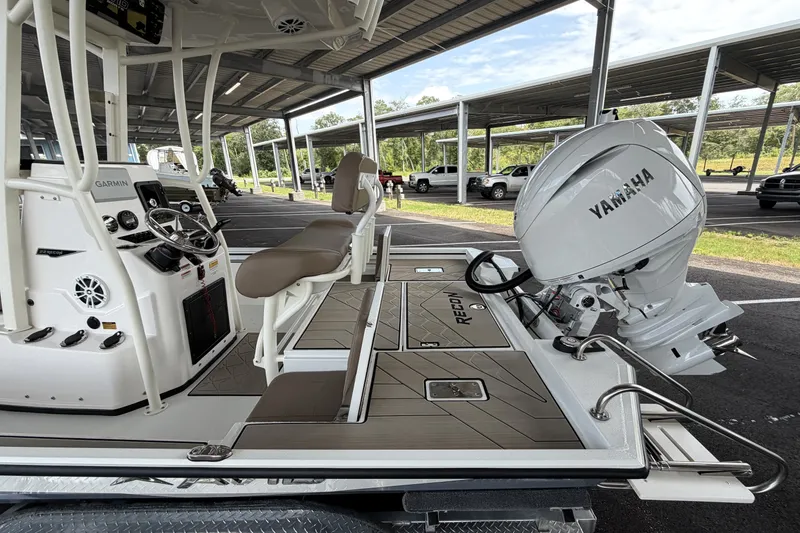 Slide: The Image of 2027 Avid 22 Recon boat with Yamaha engine, featuring Garmin navigation system. - 9