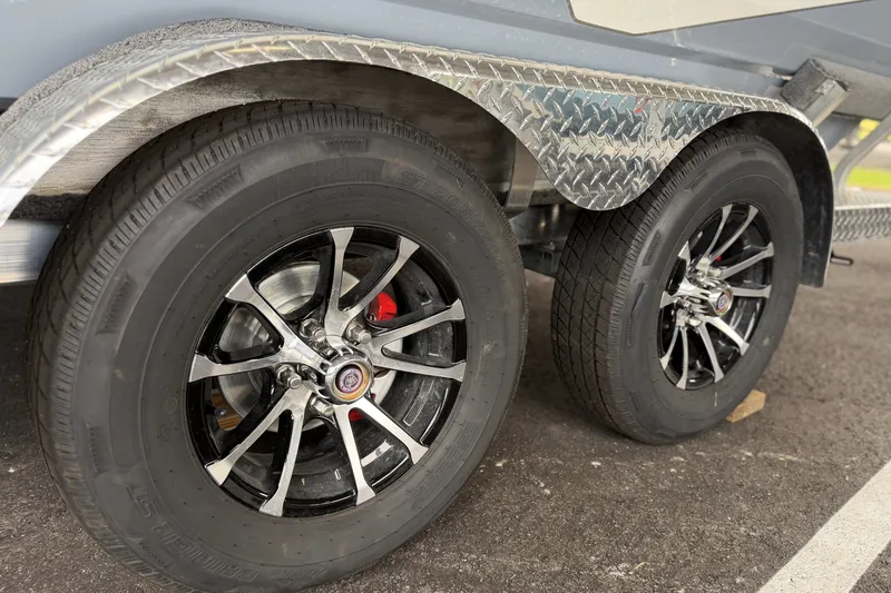 Slide: The Image of Dual wheels on Avid 22 Recon trailer, 2027 model, with diamond plate fender. - 5