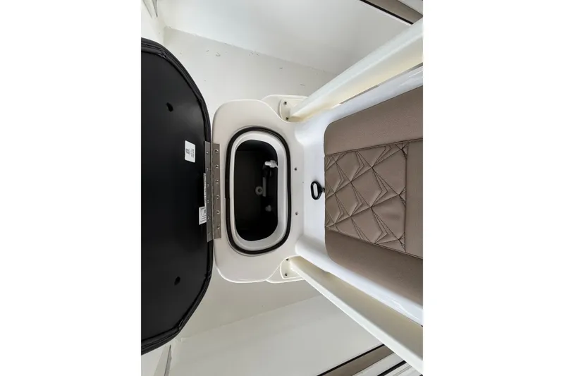 Slide: The Image of Interior view of Avid 22 Recon 2027 boat storage compartment with cushioned seating. - 27