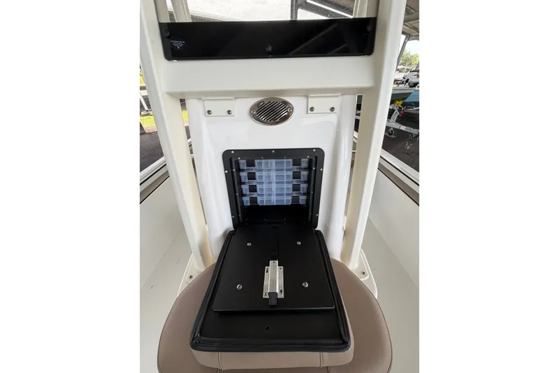 Slide: The Image of Interior view of 2027 Avid 22 Recon boat with storage compartment open. - 26