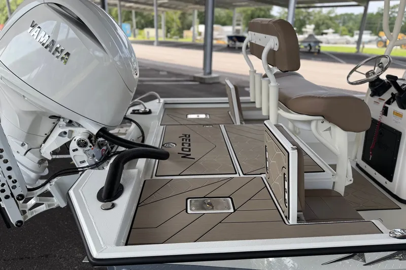 Slide: The Image of 2027 Avid 22 Recon boat with Yamaha engine, featuring sleek deck design and comfortable seating. - 18
