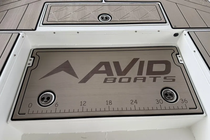 Slide: The Image of Avid 22 Recon 2027 boat deck with logo and measurement markings. - 29