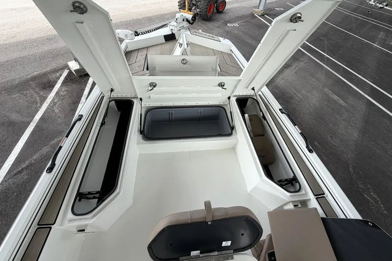 Slide: The Image of 2027 Avid 22 Recon boat interior with open storage compartments. - 34