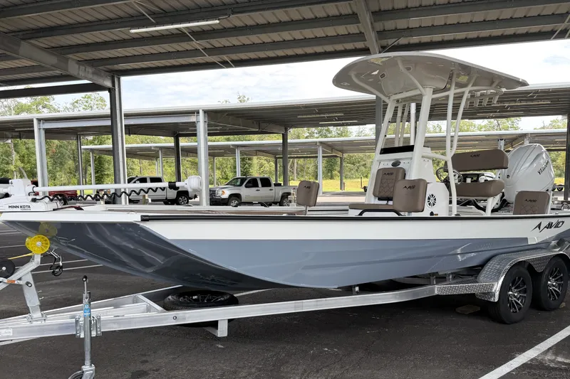 Slide: The Image of 2027 Avid 22 Recon boat on trailer in covered parking area. - 8