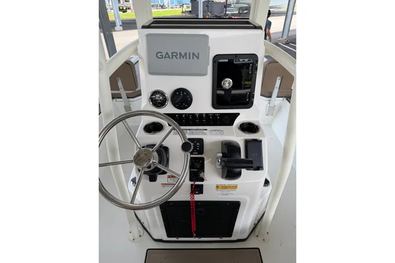 Slide: The Image of Steering console of 2027 Avid 22 Recon boat with Garmin navigation system. - 24