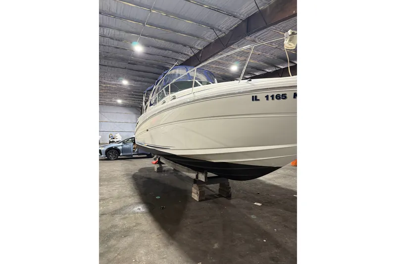 Slide: The Image of 2006 Sea Ray 300 Sundancer boat in indoor storage facility. - 1
