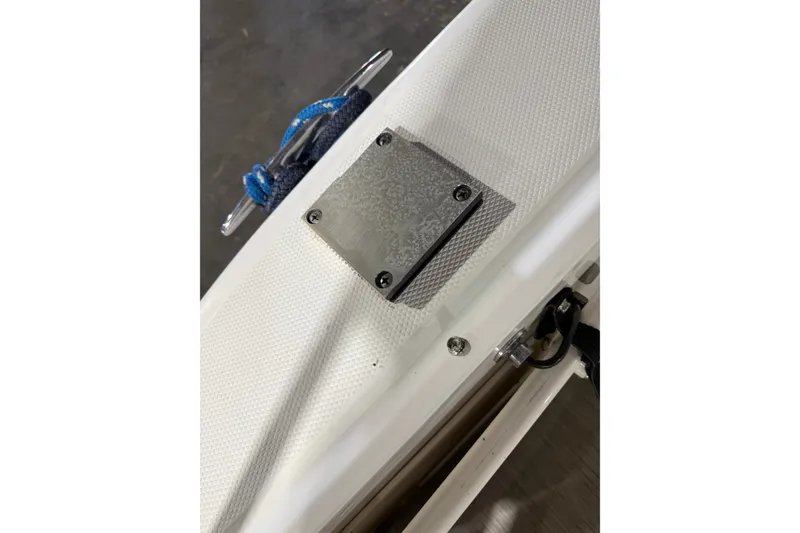 Slide: The Image of Close-up of a 2006 Sea Ray 300 Sundancer boat deck with metal plate and cleat. - 14