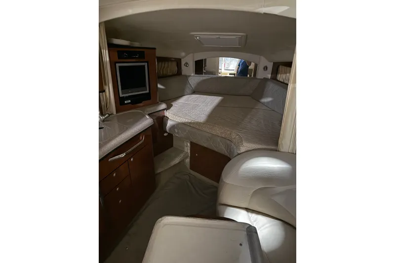 Slide: The Image of Interior of 2006 Sea Ray 300 Sundancer with cozy cabin and modern amenities. - 8