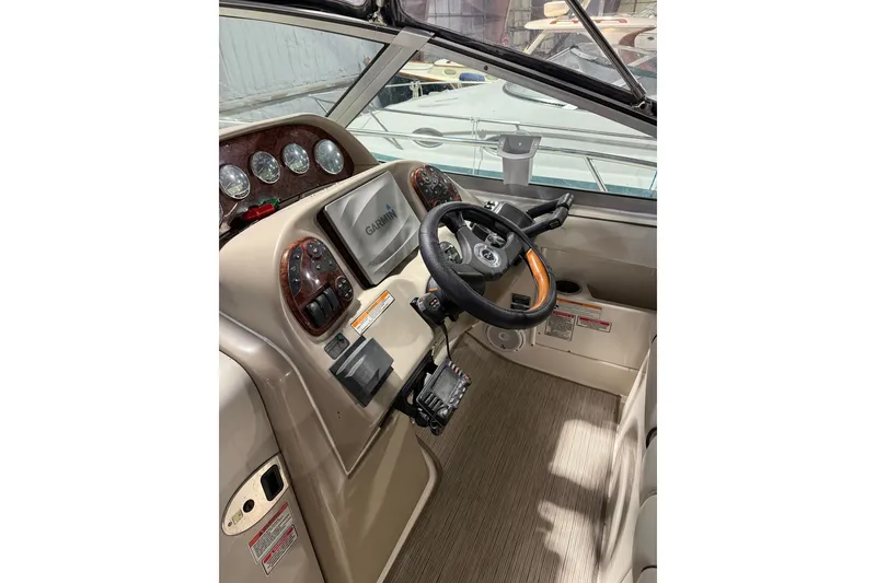 Slide: The Image of Cockpit of 2006 Sea Ray 300 Sundancer with Garmin navigation system. - 11
