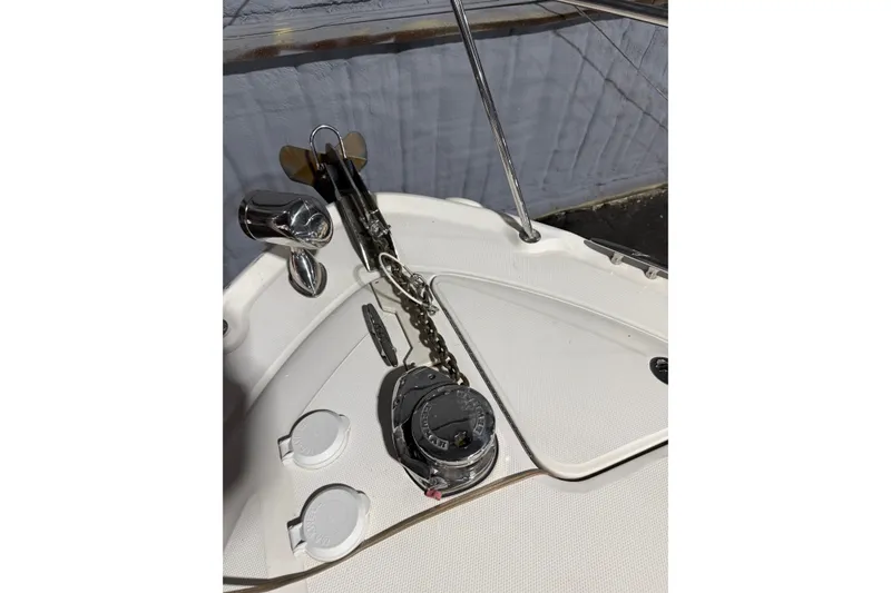 Slide: The Image of 2006 Sea Ray 300 Sundancer boat deck with anchor chain and winch system. - 12