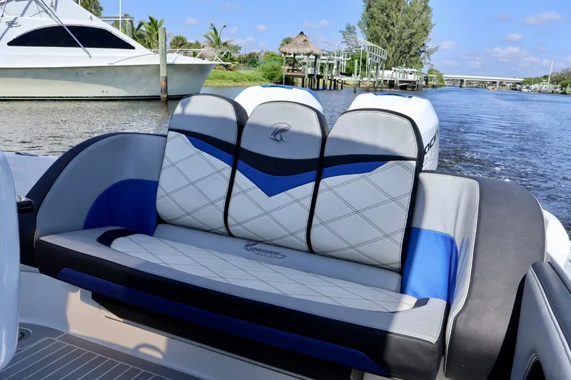 Slide: The Image of 2018 Renegade 33 Open boat with stylish seating on a scenic waterway. - 34