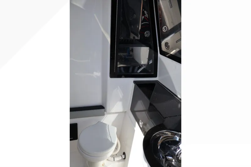 Slide: The Image of Interior of 2018 Renegade 33 Open boat, featuring sleek design and modern amenities. - 47
