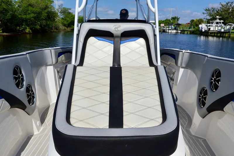 Slide: The Image of 2018 Renegade 33 Open boat interior with cushioned seating and sleek design. - 31