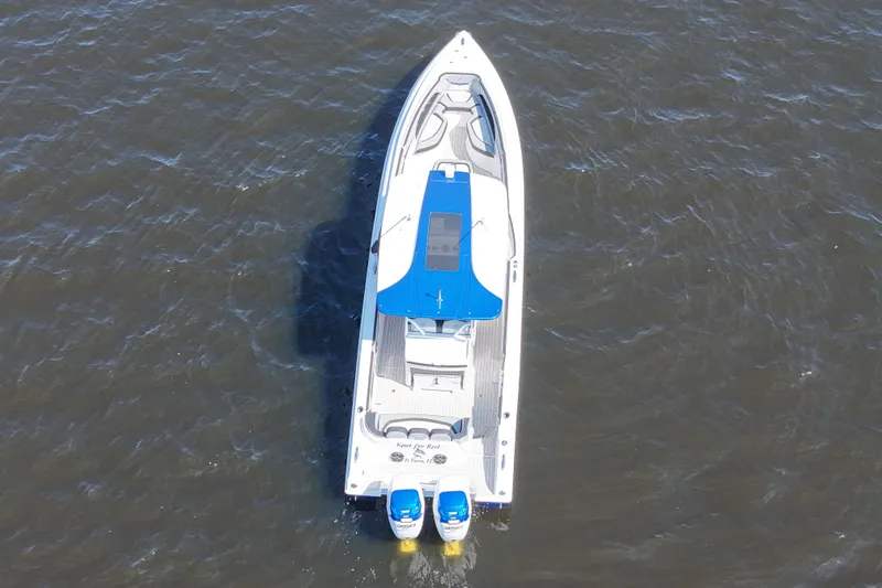 Slide: The Image of Aerial view of 2018 Renegade 33 Open boat on water. - 27