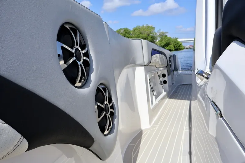 Slide: The Image of 2018 Renegade 33 Open boat interior with sleek design and modern speakers. - 32