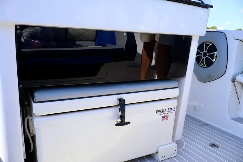 Slide: The Image of 2018 Renegade 33 Open boat interior with Frigid Rigid cooler and speaker. - 36