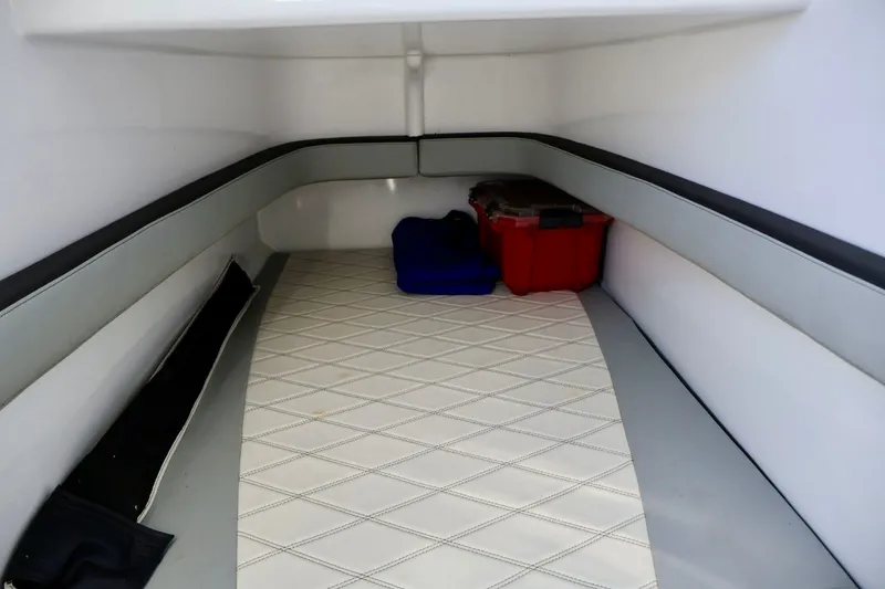 Slide: The Image of Interior cabin of 2018 Renegade 33 Open boat with storage boxes. - 44
