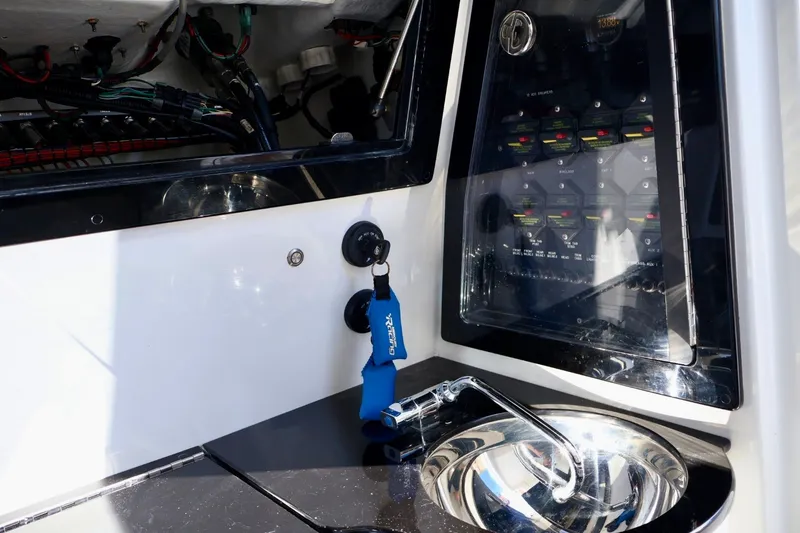 Slide: The Image of 2018 Renegade 33 Open boat interior with control panel and sink. - 45