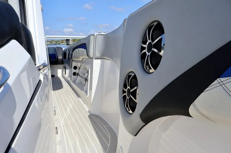 Slide: The Image of Interior view of 2018 Renegade 33 Open boat with sleek design and speakers. - 33