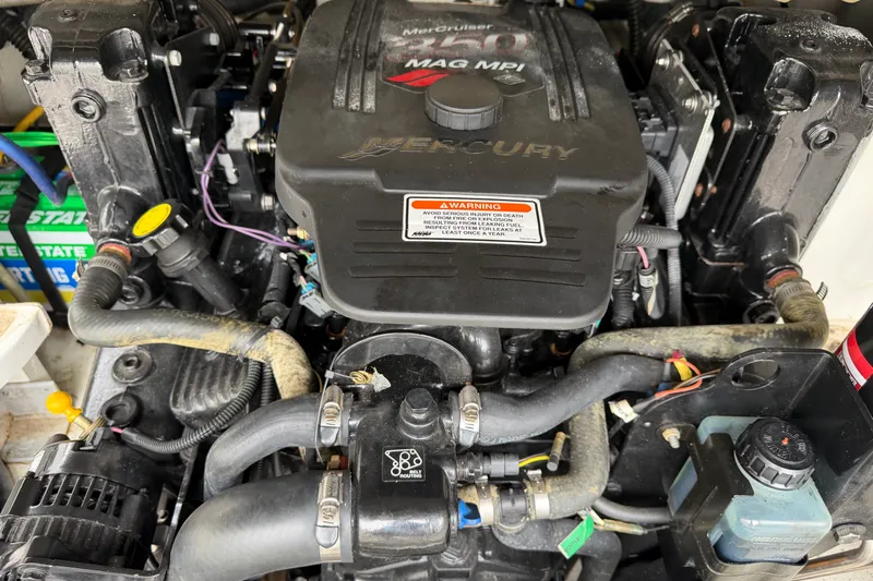 Slide: The Image of Engine of a 2007 Crownline 240 EX boat, featuring MerCruiser MAG MPI components. - 16