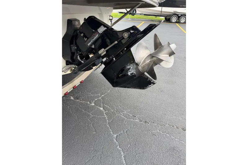 Slide: The Image of Outboard motor of a 2007 Crownline 240 EX boat on a concrete surface. - 19