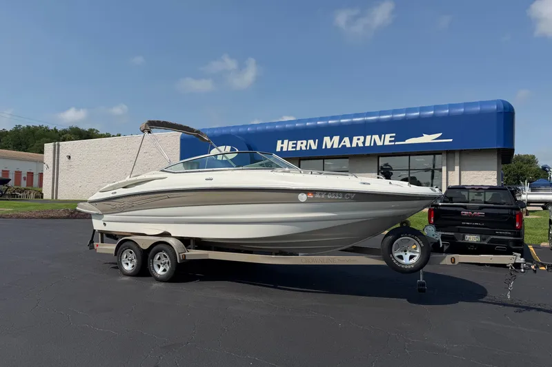 The Image of 2007 Crownline 240 EX boat on trailer at Hern Marine dealership. - 0