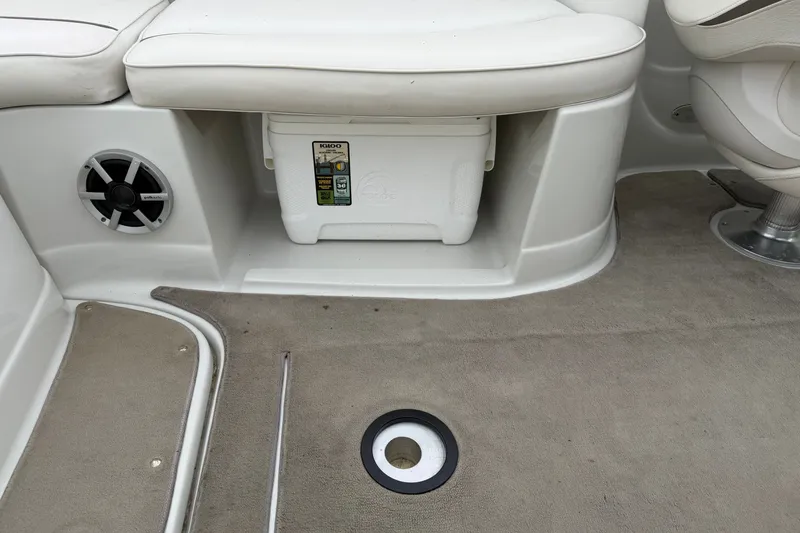 Slide: The Image of Interior of a 2007 Crownline 240 EX boat with seating and storage area. - 24