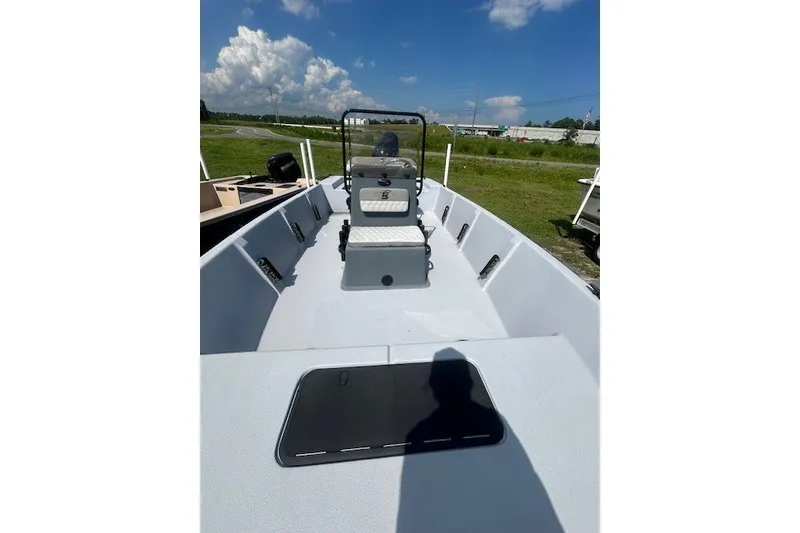 Slide: The Image of 2025 Carolina Skiff EV218 Sea Skiff boat interior under clear blue sky. - 6