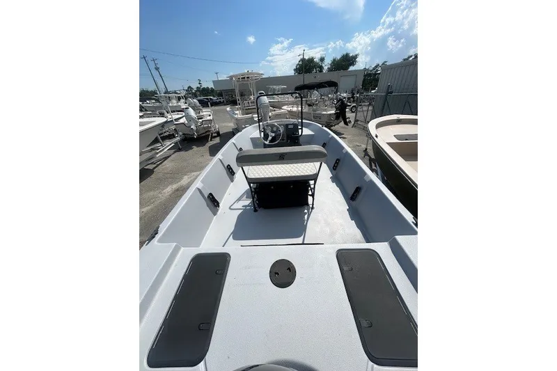 Slide: The Image of 2025 Carolina Skiff EV218 Sea Skiff boat interior, showcasing spacious deck and seating. - 11