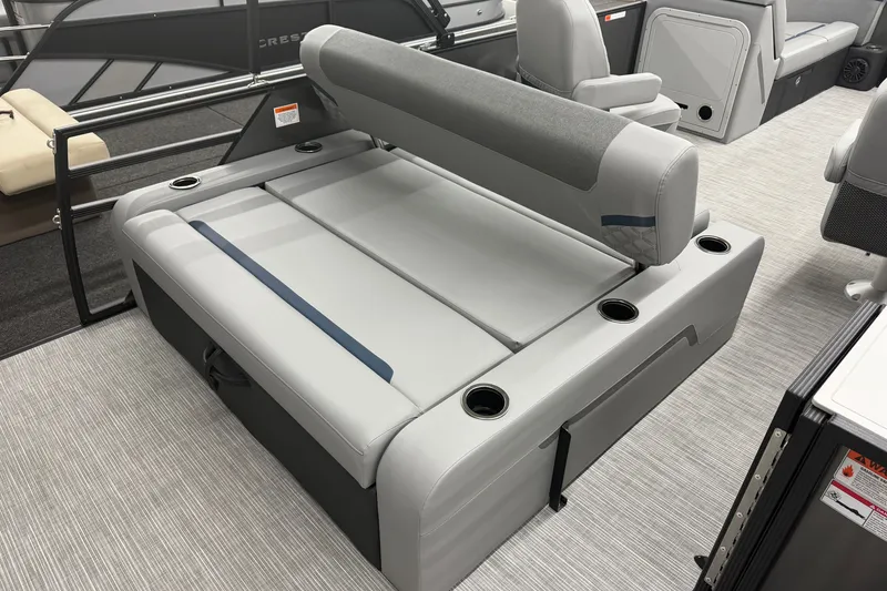Slide: The Image of 2027 Crest Conquest 230 SLSC boat interior with gray seating and cup holders. - 16