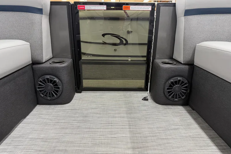 Slide: The Image of Interior of 2027 Crest Conquest 230 SLSC boat with speakers and seating. - 3