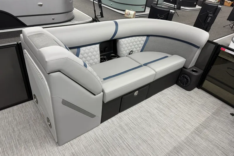 Slide: The Image of 2027 Crest Conquest 230 SLSC boat interior seating with modern design and storage compartments. - 7